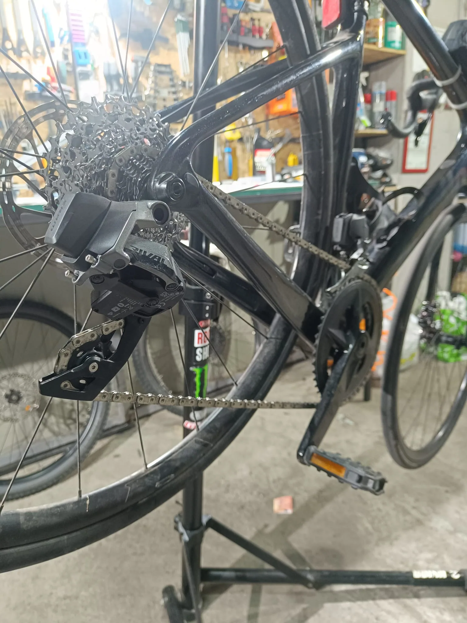 Close-up of a SRAM rear derailleur, cassette and chain in the workshop