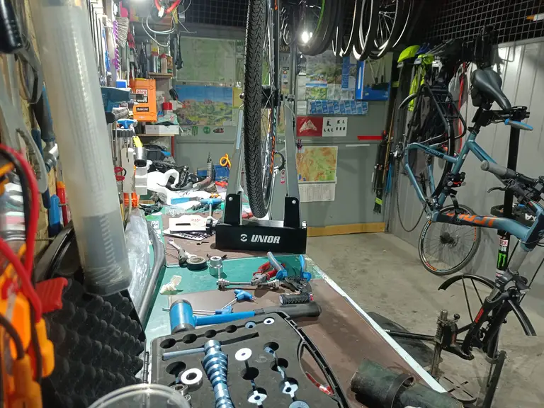 Bicycle wheel in a truing stand in the workshop